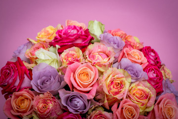 Beautiful bouquet of roses in a gift box. Bouquet of pink roses. Pink roses close-up. on pink background, with space for text.