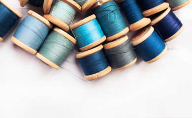 Sewing thread blue on white background