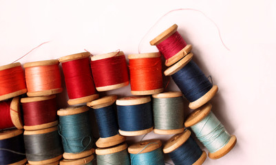 Sewing thread colored on white background