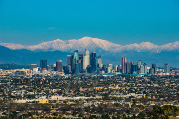 Los Angeles Cityscape with Snowcapped Mountains