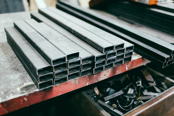 metal pipes metal products are on the table ferrous metal pipes