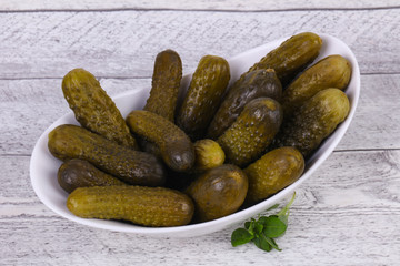 Pickled cucumbers heap in the bowl