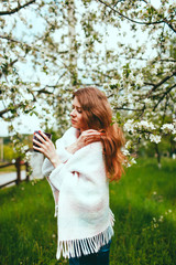 young girl in the flowered garden Girl and flowering trees