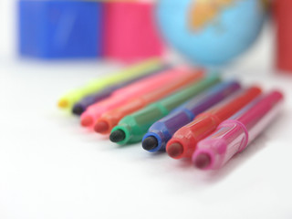close up. multicolored markers on white background. photo with copy space