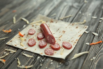 salami sliced on pita bread.preparation of Shawarma. photo with copy space