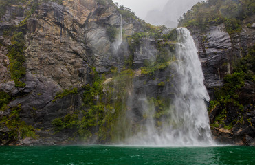 Misty falls at Milford Sound, New Zealand