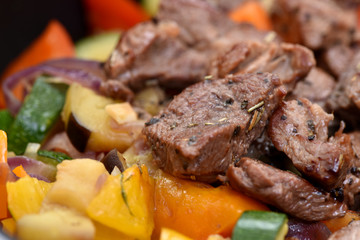 Beef stew with potatoes, carrots and sweet peppers.