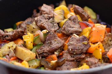 Beef stew with potatoes, carrots and sweet peppers.