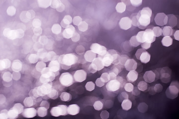 Photo bokeh abstraction in purple tones. Gorgeous Christmas lights. Holiday concept. Blur