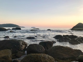 sunset on coast of sea