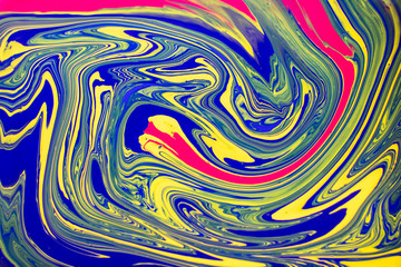 Fototapeta na wymiar Abstract background with psychedelic vivid colors. Marbleized bright effect with fluid painting, background for wallpapers, poster, postcard. Swirls and lines with yellow, blue, purple and magenta.