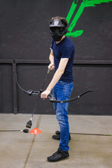 Man with crossbow arrows bow. The Archer takes aim, sharpshooter. Crossbow club.