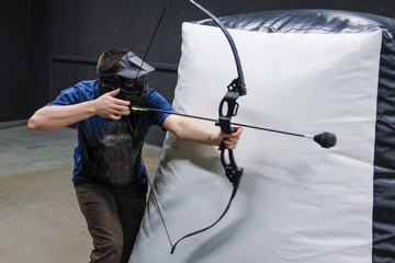Man with crossbow arrows bow. The Archer takes aim, sharpshooter. Crossbow club.