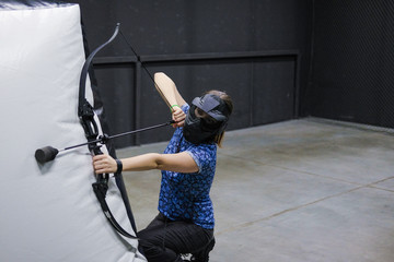 Female with crossbow arrows bow. The Archer takes aim, sharpshooter. Crossbow club.