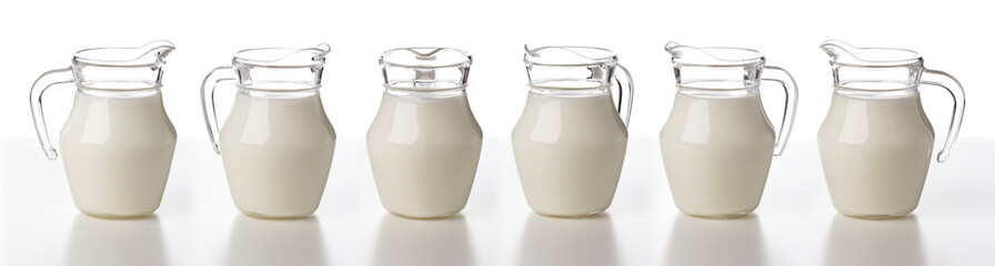 Glass jug of milk isolated on white background, collection