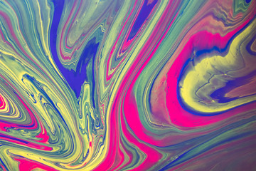 Abstract background with psychedelic vivid colors. Marbleized bright effect with fluid painting, background for wallpapers, poster, postcard. Swirls and lines with yellow, blue, purple and magenta.