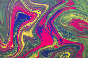 Abstract background with psychedelic vivid colors. Marbleized bright effect with fluid painting, background for wallpapers, poster, postcard. Swirls and lines with yellow, blue, purple and magenta.