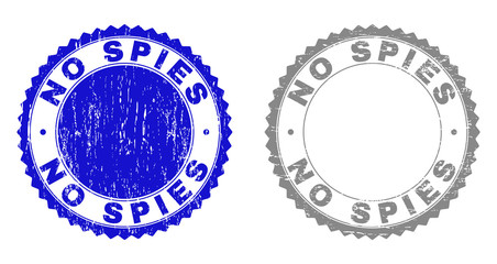 Grunge NO SPIES stamp seals isolated on a white background. Rosette seals with grunge texture in blue and gray colors. Vector rubber stamp imitation of NO SPIES title inside round rosette.