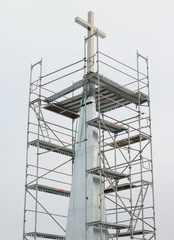 Installation of a new cross on a Catholic church