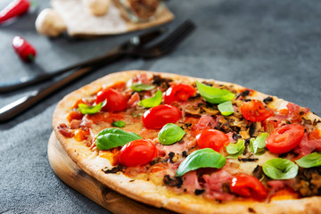 pizza cooked with standard cooked ham and mushrooms