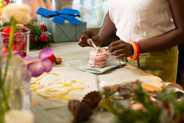 Professional florist working carefully with tender goods