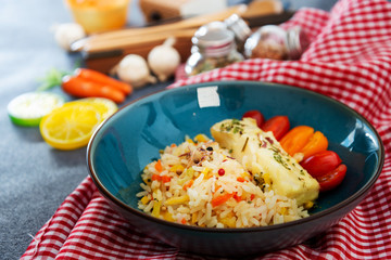 Andalusian fish, saffron rice with vegetables