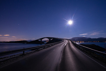 Night with the moon and view on the Atlantic Ocean Road in Norway.