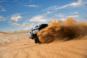 Freeze motion of four wheel drive through the desert in the United Arab Emirates. © Lukas Gojda