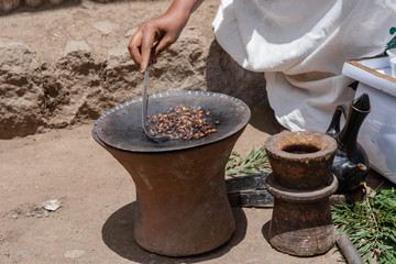 Lalibela. Ethiopia. Africa. 2016. The process of making Ethiopian coffee. On the street Lalibela you can order and drink coffee of very good quality. When you have a grain of coffee to fry, grill and 