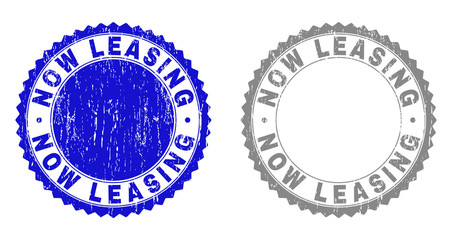 Grunge NOW LEASING stamp seals isolated on a white background. Rosette seals with grunge texture in blue and grey colors. Vector rubber watermark of NOW LEASING tag inside round rosette.