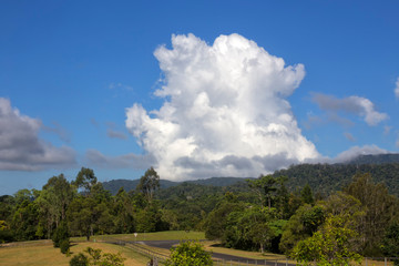 Wlidfire smoke and cumulus clouds near Kuranda in Tropical North Queensland, Australia