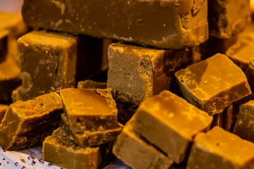 Chocolate nuts halva with honey photographed with shallow depth of field.