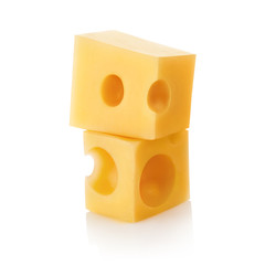 Two small pieces of delicious cheese, isolated on white background