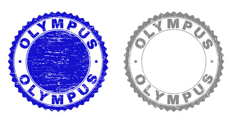 Grunge OLYMPUS stamp seals isolated on a white background. Rosette seals with grunge texture in blue and gray colors. Vector rubber stamp imitation of OLYMPUS text inside round rosette.