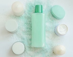 Spa treatments. Beautiful spa composition with  flowers on table close up. Spa still life with aromatic candles,candle background light  table relaxation spa beauty aromatherapy luxury closeup.