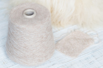 Skein of natural threads on the background of fur