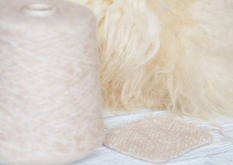 Skein of natural threads on the background of fur