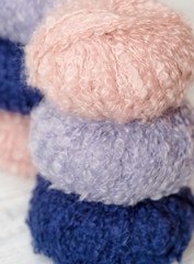 Fototapeta na wymiar Skeins of multicolored wool yarn close up