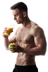 Handsome athletic man posing with shaker on white