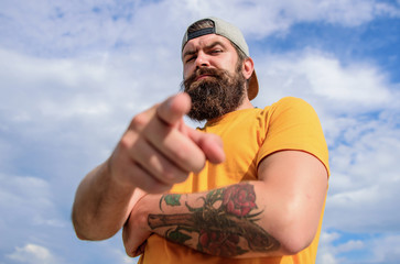 Hey you. Man bearded muscular brutal hipster outdoors sky background. Masculinity and brutality....