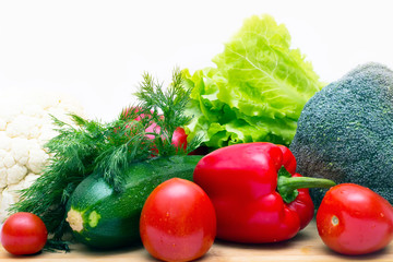Various vegetables close to a white background
