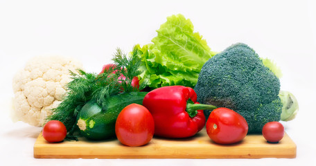 Various vegetables close to a white background