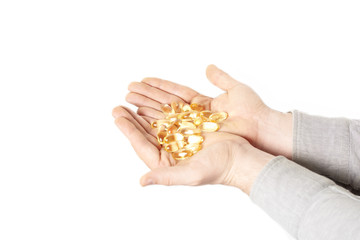 Fototapeta premium pills in male hand closeup on white background