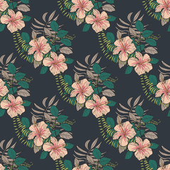 Tropical pattern with hibiscus flowers and leaves on a dark background. Floral background.