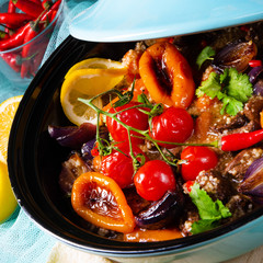 Tasty spicy beef with various vegetables cooked in tagine