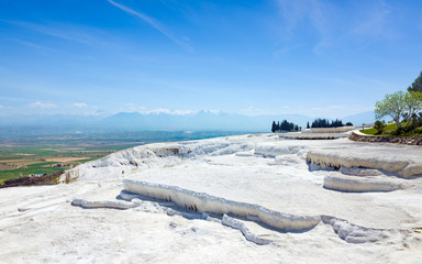 White travertine terrace formations, dry pools in Pamukkale, Turkey