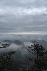 Obraz premium Top of the mountain with gray sky 