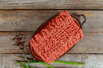 Flat lay fresh ingredients for cooking ground beef meat, black pepper and asparagus