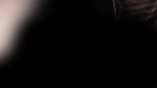 Graffiti artist spray painting the screen to create solid color background copy space. Street art and alternative youth lifestyle concept.