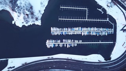Top down view on boats in a harbor near e18 in Oslo, Norway - Powered by Adobe